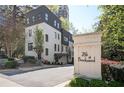Stylish townhome exterior with brick accents, dark trim, and professional landscaping at 1821 Huntington Hills Nw Ln, Atlanta, GA 30309