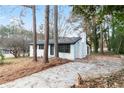 Picture of a white brick home with an extended driveway, offering convenient parking at 3215 Pennignton Cir, Atlanta, GA 30354