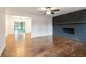 Inviting living room features hardwood floors, a brick fireplace, and ample space for relaxation at 3215 Pennignton Cir, Atlanta, GA 30354