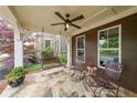 Relaxing front porch with swing, chairs, and overhead fan at 423 Hunt Ne St, Marietta, GA 30060