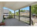 Inviting covered front porch with railing, ideal for relaxing and enjoying the neighborhood views at 509 Roy Sw St, Atlanta, GA 30310