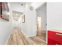 Long hallway with wood floors, leading to the bedrooms and bathroom at 509 Roy Sw St, Atlanta, GA 30310
