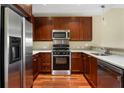 The U-shaped kitchen features stainless appliances, dark cabinetry, and light countertops at 201 W Ponce De Leon Ave # 515, Decatur, GA 30030