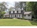 Charming two-story home with a well-manicured lawn and lush landscaping providing great curb appeal at 3501 Emperor Way, Tucker, GA 30084