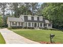 Beautiful home featuring lush green lawn and a long driveway for ample parking at 3501 Emperor Way, Tucker, GA 30084