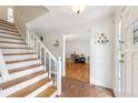 Welcoming foyer with hardwood floors and a staircase leading to the upper level at 3501 Emperor Way, Tucker, GA 30084