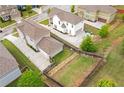 Aerial view showcasing the property, a private backyard, and an extended driveway to a detached garage at 2342 Terrace View Sw Cir, Atlanta, GA 30315