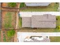 Aerial view features the property's roof, long driveway, and a well-defined, fenced backyard space at 2342 Terrace View Sw Cir, Atlanta, GA 30315