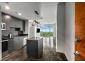 Modern kitchen featuring sleek countertops, stainless steel appliances, and an island at 250 Pharr Ne Rd # 716, Atlanta, GA 30305