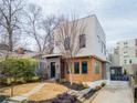 Contemporary home with mixed materials, professionally landscaped front yard, and a welcoming path leading to the entrance at 522 Boulevard Ne Pl, Atlanta, GA 30308