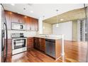Modern kitchen with stainless steel appliances, granite countertops, and sleek cabinetry at 855 Peachtree Ne St # 2001, Atlanta, GA 30308