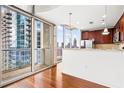 Contemporary kitchen featuring granite countertops, stainless steel appliances, and cityscape views at 855 Peachtree Ne St # 2001, Atlanta, GA 30308