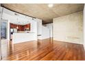 Spacious living room with concrete ceilings and expansive windows offering city views at 855 Peachtree Ne St # 2001, Atlanta, GA 30308