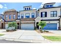 Attractive townhomes show individual design and attached garages with manicured landscaping at 240 Walker Avenue, Roswell, GA 30076
