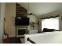 Inviting living room with fireplace and large television at 1425 Watercrest Cir, Lawrenceville, GA 30043