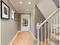 Inviting entryway with hardwood floors and stairs at 220 N Springs Ct, Sandy Springs, GA 30328