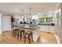 Bright kitchen with white cabinets, stainless steel appliances, and a large center island at 220 N Springs Ct, Sandy Springs, GA 30328