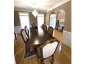 Formal dining room with hardwood floors, large table, and elegant chandelier at 2532 Greenes Ln, Powder Springs, GA 30127