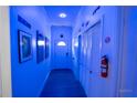 Bright hallway with wall art, storage, and door leading to a room at 3273 Elm St, Atlanta, GA 30337