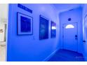 Bright hallway with wall art and door leading to a room at 3273 Elm St, Atlanta, GA 30337