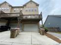 Townhouse with a spacious rear deck, parking, and garage for convenience at 790 Village Field Ct, Suwanee, GA 30024