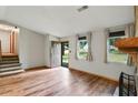 Bright living room with wood floors, stone fireplace, and natural light at 2420 Leaf Land Dr, Duluth, GA 30097