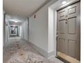 Hallway leading to the unit door with carpeted floors and neutral wall paint at 3203 Lenox Ne Rd # 22, Atlanta, GA 30324
