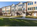 View of new townhomes featuring stone accents and neutral color palettes on a sunny day at 3794 Jack Vernon Cir, Powder Springs, GA 30127