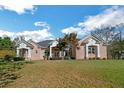 Spacious brick home with well-manicured lawn and mature trees, offering a picturesque setting at 6740 Mountain Lake Ln, Cumming, GA 30028