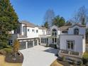 Stunning modern home with a three-car garage and beautiful architectural details at 255 Northland Ridge Trl, Atlanta, GA 30342