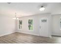 Bright living room with stylish gray flooring, white walls, and natural light streaming through the windows at 35 Riverbend Dr, Covington, GA 30014