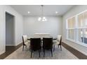 Bright dining room with modern chandelier and neutral decor at 807 Parker Pass, Peachtree City, GA 30269