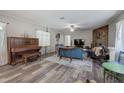 Inviting living room with beautiful wood floors, a cozy fireplace, and ample natural light at 3156 Pope Rd, Douglasville, GA 30135