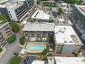 Aerial view of the complex shows a pool and outdoor lounging area at 660 Glen Iris Dr # 206 & 109, Atlanta, GA 30308