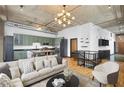 Living area with updated green kitchen, couch, and hardwood flooring at 660 Glen Iris Dr # 206 & 109, Atlanta, GA 30308
