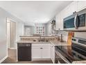 Modern kitchen with stainless steel appliances, stylish countertops, and sleek black dishwasher at 999 Washington Sw St, Atlanta, GA 30315