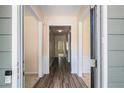Hallway features wood flooring, neutral walls, and classic trim, offering a bright and welcoming entrance at 3634 Cape Ln, Conyers, GA 30013