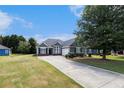 Attractive single-Gathering home featuring lush green lawn, long driveway and a well-maintained exterior at 3634 Cape Ln, Conyers, GA 30013