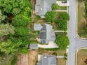 Aerial view of a home featuring a large lot and mature trees in a residential neighborhood at 450 Bay Grove Se Rd, Loganville, GA 30052