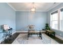 Bright office with natural light, unique desk, and stylish decor, perfect for working from home at 719 Elizabeth Trl, Woodstock, GA 30189