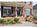 Inviting front porch with seating and seasonal decorations, adding curb appeal at 1365 Juniper Springs Trl, Loganville, GA 30052