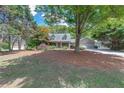 Inviting two-story home with mature trees and a spacious front yard at 2285 Ashton Ridge Dr, Dacula, GA 30019