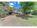 Beautiful home with manicured lawn, mature trees, and an inviting facade at 2285 Ashton Ridge Dr, Dacula, GA 30019