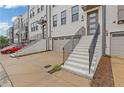 Upscale painted brick townhomes with individual garages and landscaped entry stairs at 830 Stone Ridge Ln, Atlanta, GA 30324