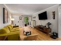 Bright living room featuring hardwood floors, a comfortable couch, and a flat-screen TV at 1177 Church St # A, Decatur, GA 30030