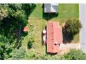An aerial view of the home showcasing the backyard, patio, and surrounding greenery at 1420 Hillside Se Pl, Conyers, GA 30094
