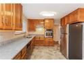 Updated kitchen with stainless steel appliances, granite countertops, and custom cabinetry at 592 Cricket Hill Trl, Lawrenceville, GA 30044