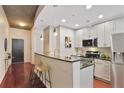 Well-lit kitchen with breakfast bar, stainless steel appliances, and modern cabinetry at 855 Peachtree Ne St # 1311, Atlanta, GA 30308