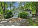 Charming home with mature trees, sidewalk and ample parking space at 4202 Maplewood Dr, Decatur, GA 30035
