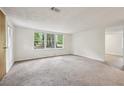 Bright living room with plush carpeting and large windows at 4202 Maplewood Dr, Decatur, GA 30035